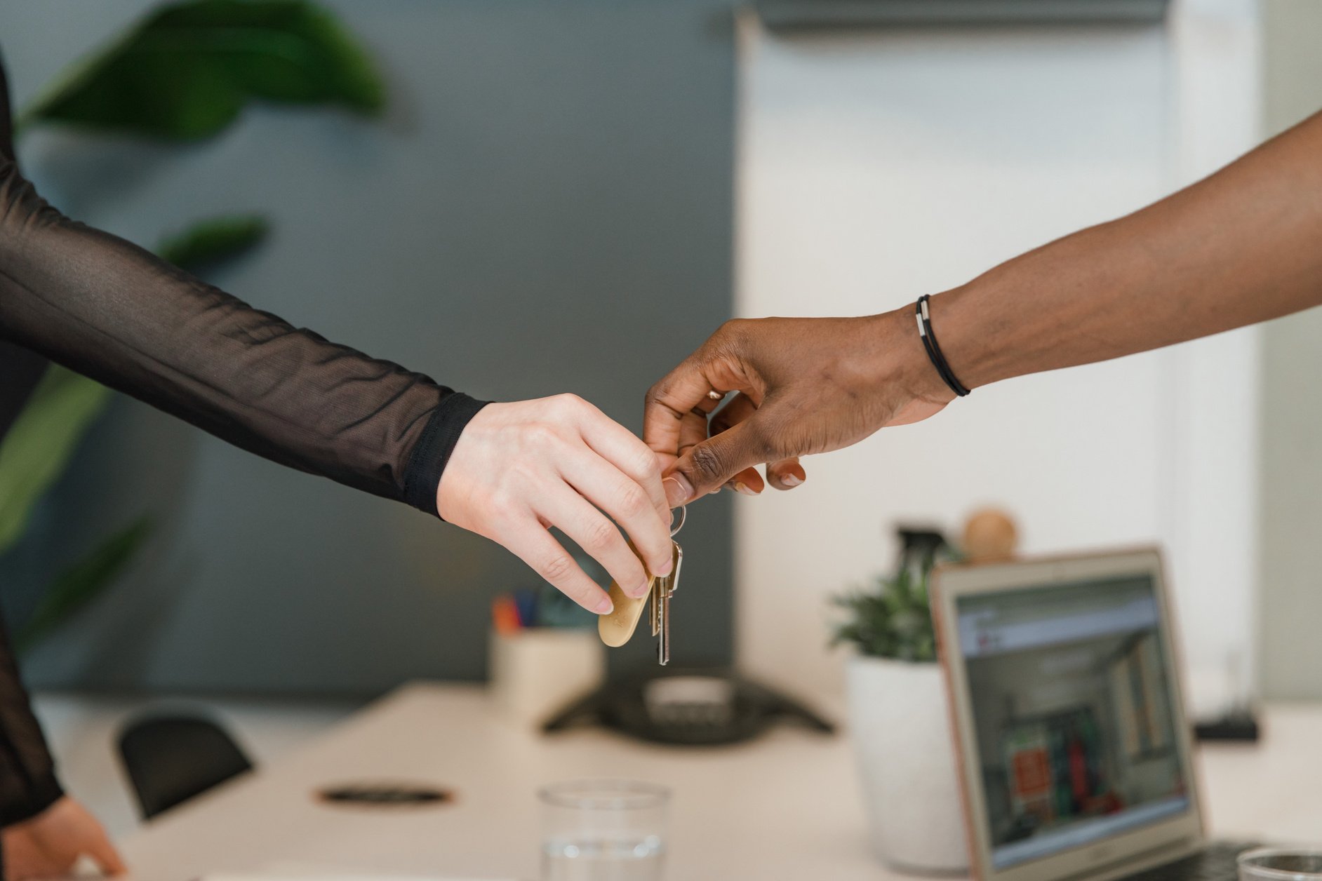 Hands exchanging keys